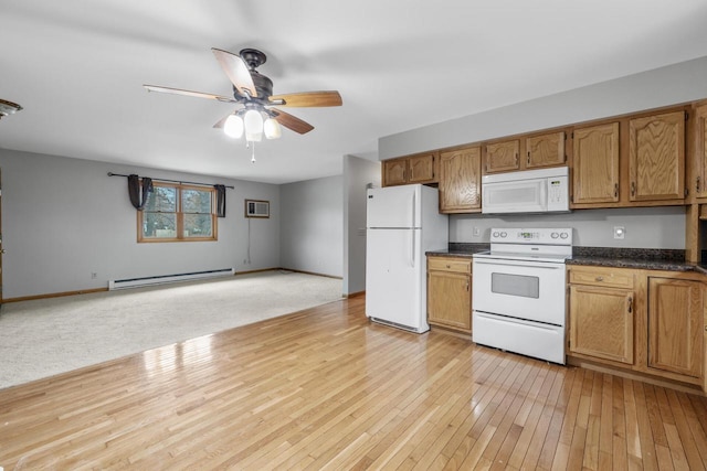167 W Paradise Dr, West Bend, WI 53095 - kitchen with white appliances, a baseboard radiator, dark countertops, ceiling fan, and light wood finished floors