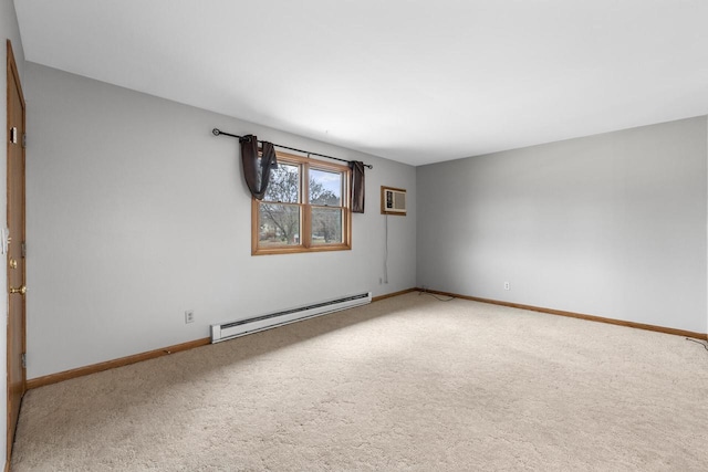 167 W Paradise Dr, West Bend, WI 53095 - carpeted empty room with baseboard heating, baseboards, and an AC wall unit