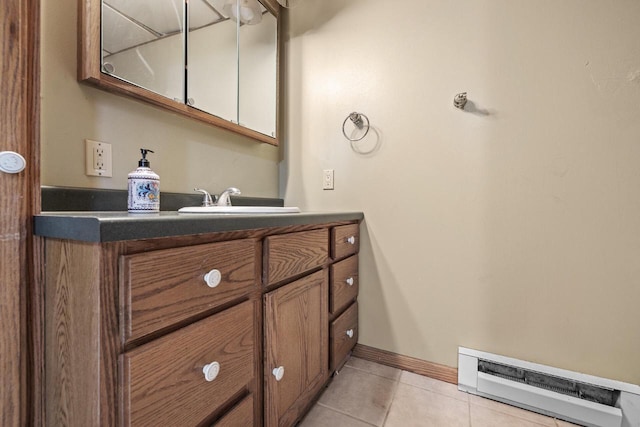 167 W Paradise Dr, West Bend, WI 53095 - bathroom with tile patterned floors, vanity, and baseboards