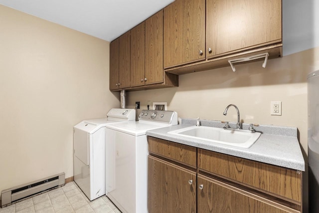 167 W Paradise Dr, West Bend, WI 53095 - clothes washing area featuring baseboard heating, cabinet space, washer and dryer, and baseboards