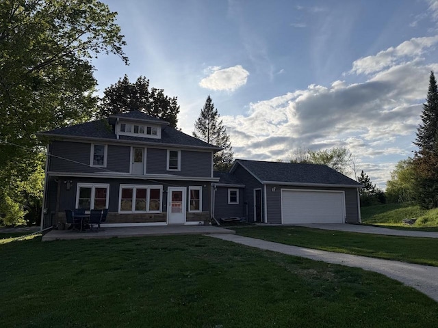 N2089 Double D Rd, Campbellsport, WI 53010 - view of front of house with a front lawn, asphalt driveway, a garage, and a patio