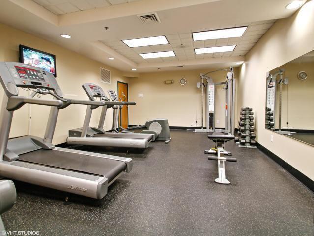 111 Center St Unit 355, Lake Geneva, WI 53147 - exercise room featuring a drop ceiling and baseboards