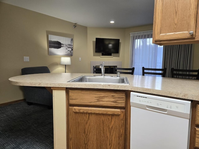 111 Center St Unit 355, Lake Geneva, WI 53147 - kitchen featuring white dishwasher, a sink, open floor plan, light countertops, and a peninsula