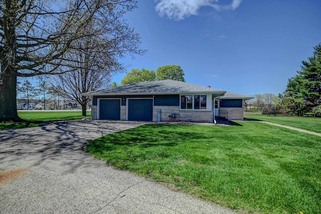 7628 W Mineral Point Rd, Verona, WI 53593 - single story home featuring driveway, a front lawn, stone siding, roof with shingles, and a garage