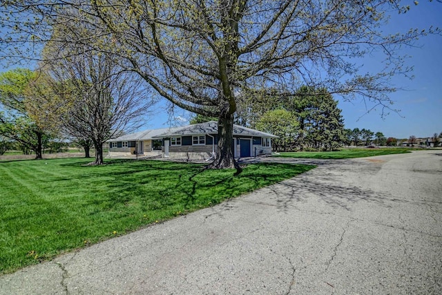 7628 W Mineral Point Rd, Verona, WI 53593 - ranch-style house with a front yard and asphalt driveway