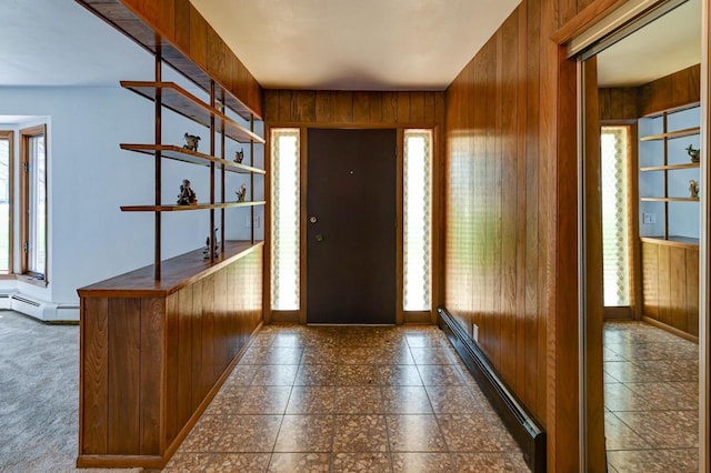 7628 W Mineral Point Rd, Verona, WI 53593 - entryway featuring a baseboard heating unit, plenty of natural light, and wood walls