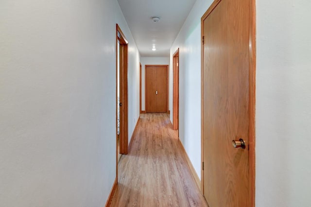 7628 W Mineral Point Rd, Verona, WI 53593 - corridor featuring light wood-style flooring and baseboards