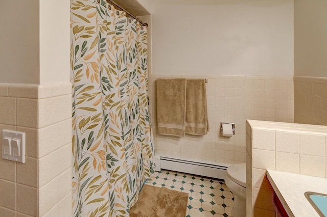 7628 W Mineral Point Rd, Verona, WI 53593 - bathroom with baseboard heating, tile walls, toilet, vanity, and wainscoting