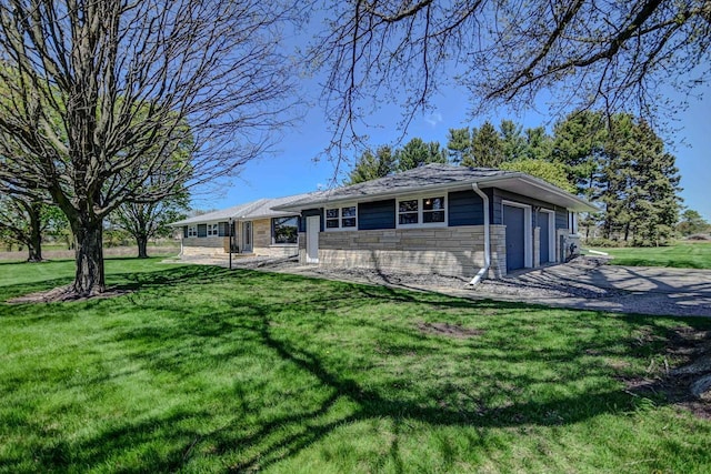 7628 W Mineral Point Rd, Verona, WI 53593 - ranch-style home with an attached garage, stone siding, driveway, and a front yard