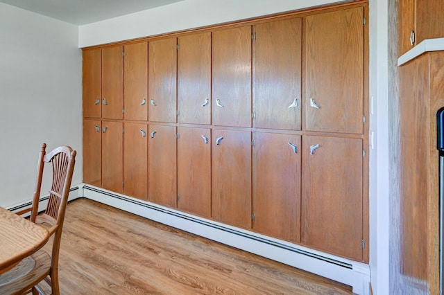 7628 W Mineral Point Rd, Verona, WI 53593 - detailed view of wood finished floors and baseboard heating