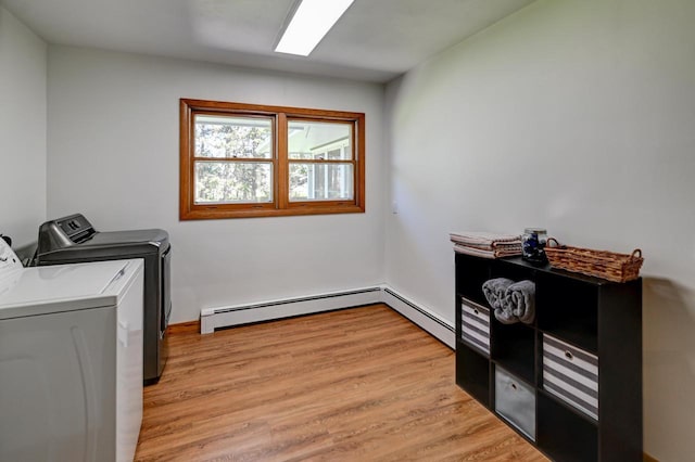 7628 W Mineral Point Rd, Verona, WI 53593 - clothes washing area with washing machine and clothes dryer, light wood finished floors, and a baseboard heating unit