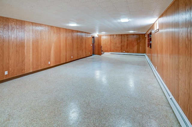 7628 W Mineral Point Rd, Verona, WI 53593 - spare room with baseboard heating, wooden walls, and baseboards