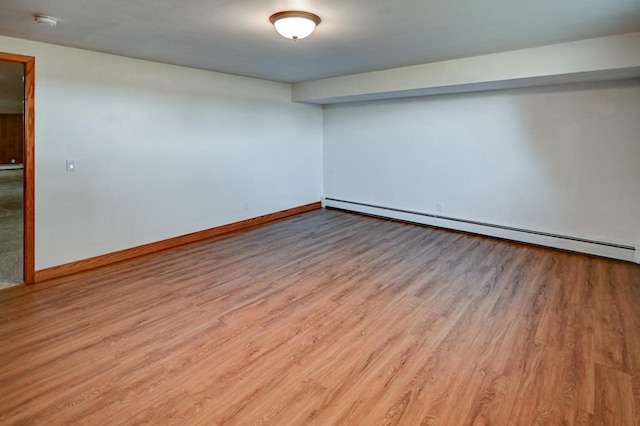 7628 W Mineral Point Rd, Verona, WI 53593 - unfurnished room with a baseboard radiator, wood finished floors, a smoke detector, and baseboards