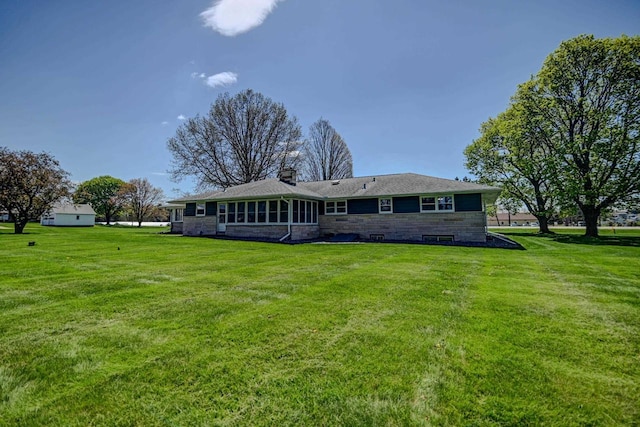 7628 W Mineral Point Rd, Verona, WI 53593 - back of property with a yard and stone siding