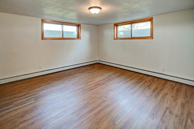 7628 W Mineral Point Rd, Verona, WI 53593 - empty room featuring wood finished floors and baseboards