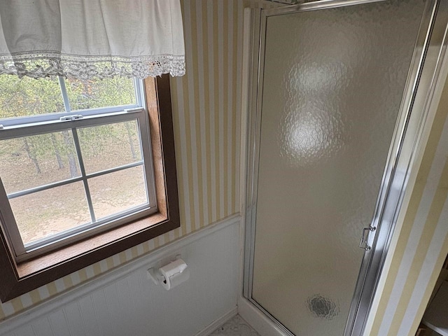 W5946 Beach Dr, New Lisbon, WI 53950 - bathroom featuring wallpapered walls and a stall shower
