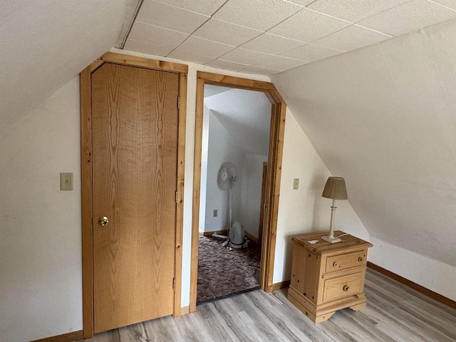 W5946 Beach Dr, New Lisbon, WI 53950 - bonus room featuring light wood finished floors, baseboards, and vaulted ceiling