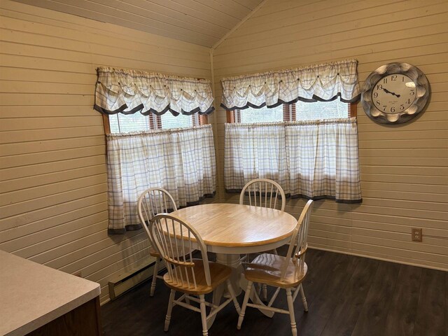 W5946 Beach Dr, New Lisbon, WI 53950 - dining room featuring vaulted ceiling, dark wood-style floors, wood walls, baseboard heating, and wooden ceiling