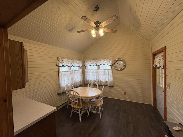 W5946 Beach Dr, New Lisbon, WI 53950 - dining space with lofted ceiling, ceiling fan, wooden walls, wood ceiling, and dark wood finished floors
