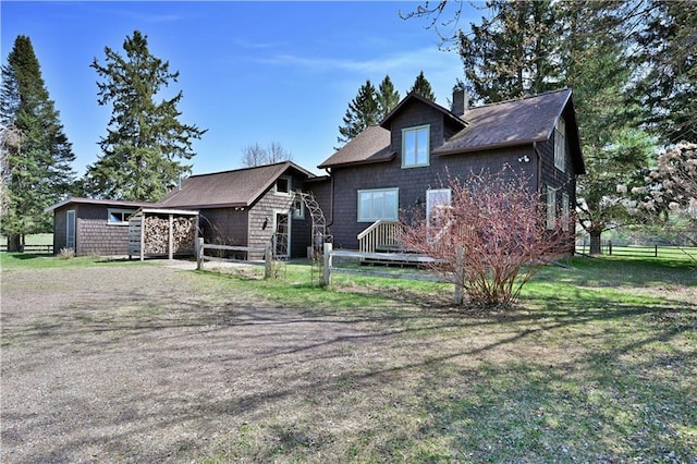 12642 Paddock Rd, Hayward, WI 54843 - view of front of property with a chimney and roof with shingles