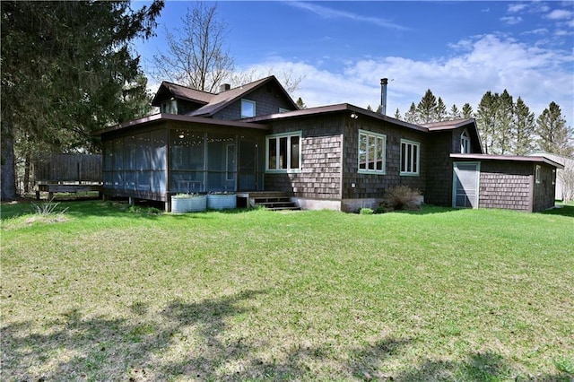12642 Paddock Rd, Hayward, WI 54843 - view of front of property with a sunroom and a front lawn