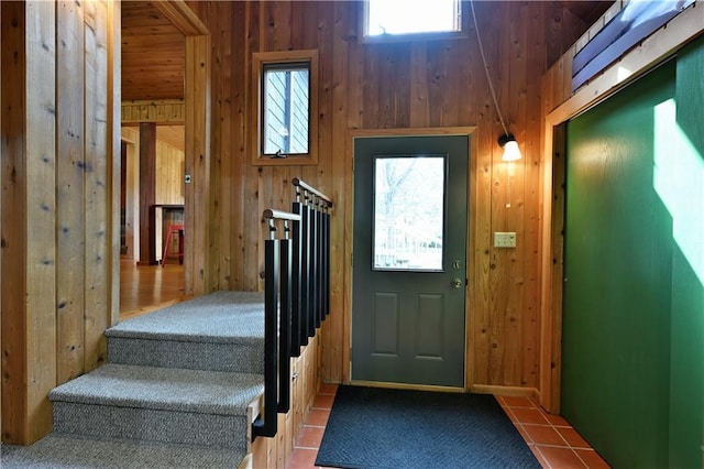 12642 Paddock Rd, Hayward, WI 54843 - foyer with wood walls and stairs