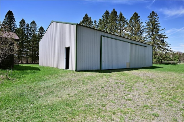 12642 Paddock Rd, Hayward, WI 54843 - view of pole building featuring a yard