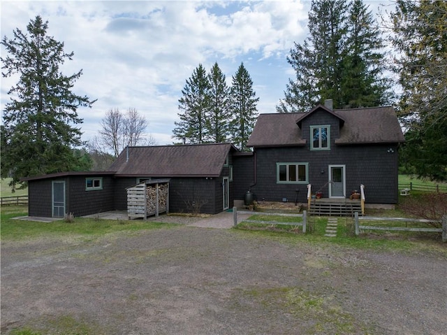12642 Paddock Rd, Hayward, WI 54843 - back of house featuring a chimney and a shingled roof