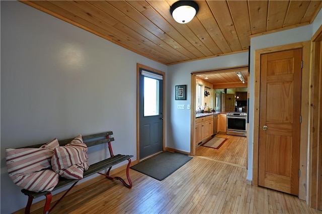 12642 Paddock Rd, Hayward, WI 54843 - foyer entrance featuring wooden ceiling and light wood-type flooring