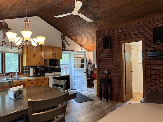 W10550 Hazelgreen Rd, Deerbrook, WI 54424 - kitchen featuring wooden ceiling, black microwave, plenty of natural light, a sink, and wood finished floors