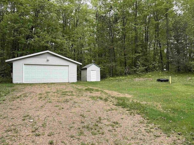 W10550 Hazelgreen Rd, Deerbrook, WI 54424 - view of yard with an outbuilding, a detached garage, and a storage unit