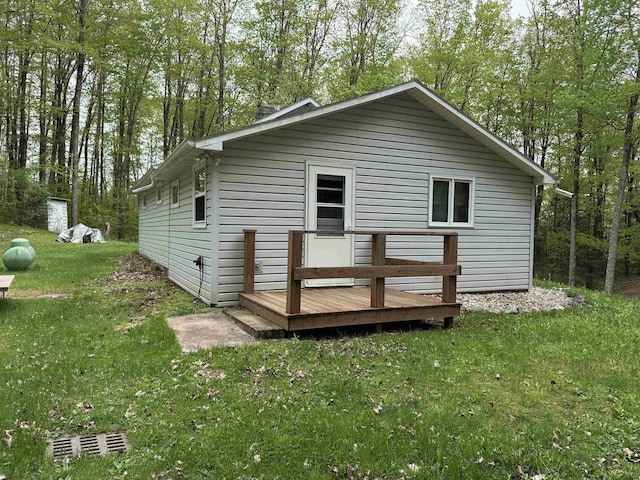 W10550 Hazelgreen Rd, Deerbrook, WI 54424 - rear view of house with a wooden deck and a yard