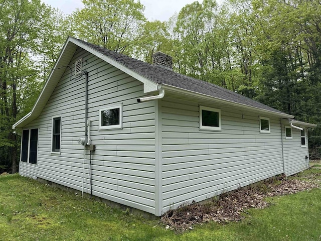 W10550 Hazelgreen Rd, Deerbrook, WI 54424 - view of home's exterior with a chimney and a shingled roof