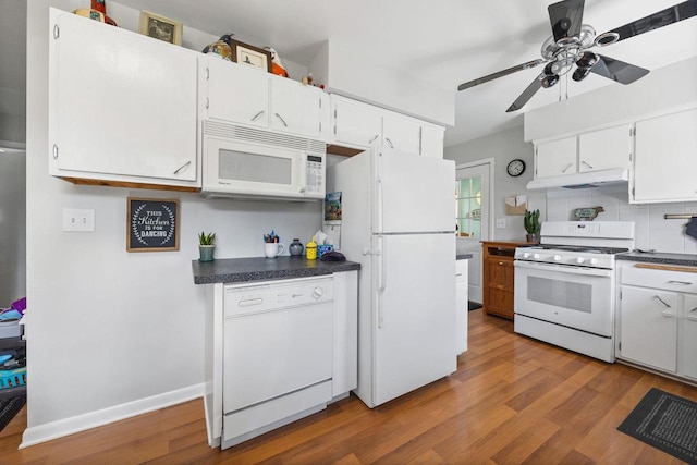 N2356 County Road D Ft, Atkinson, WI 53538 - kitchen with white appliances, under cabinet range hood, dark countertops, and a ceiling fan