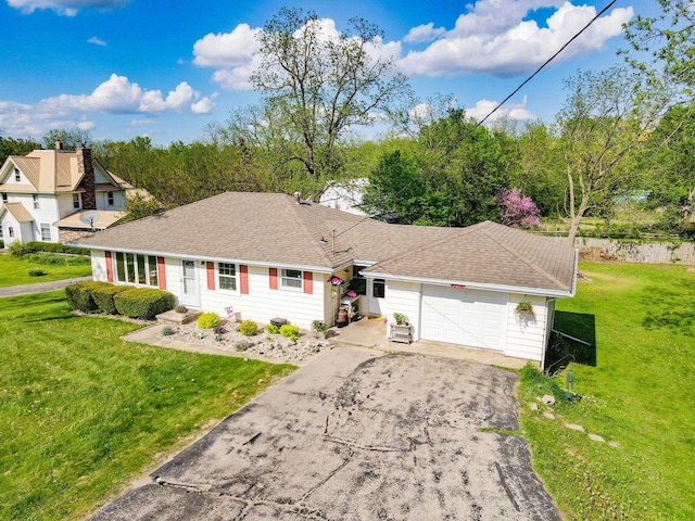 N2356 County Road D Ft, Atkinson, WI 53538 - single story home with driveway, a front lawn, a garage, and roof with shingles
