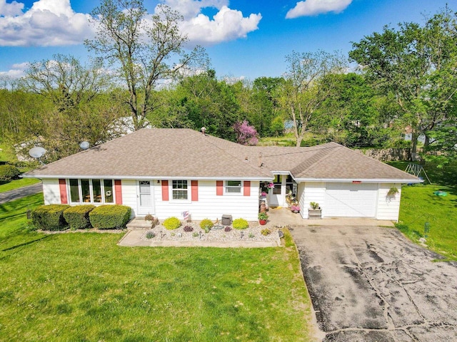 N2356 County Road D Ft, Atkinson, WI 53538 - ranch-style home with driveway, an attached garage, and a front lawn