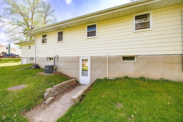 N2356 County Road D Ft, Atkinson, WI 53538 - rear view of house featuring a yard and central AC