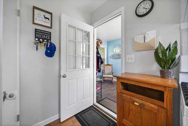 N2356 County Road D Ft, Atkinson, WI 53538 - doorway to outside featuring wood finished floors and baseboards