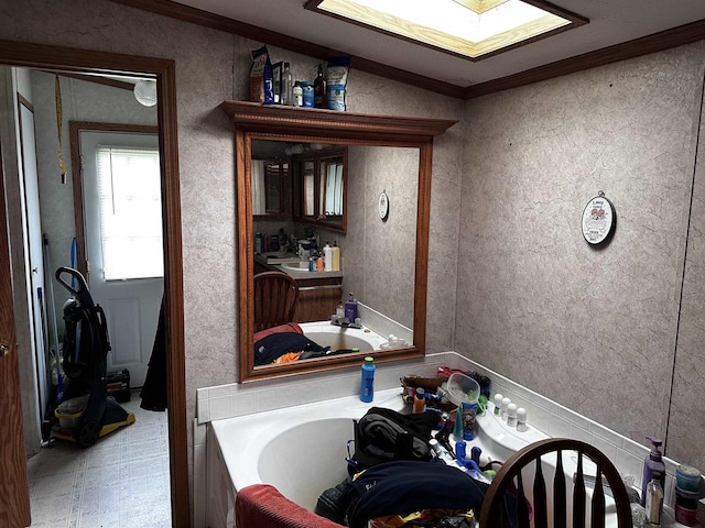 7962 N State Highway 45, Eland, WI 54427 - bathroom featuring ornamental molding, a tub, and a skylight