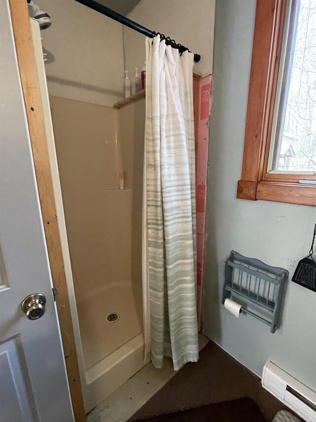 N18355 Big Bear Rd, Pembine, WI 54156 - full bathroom featuring a baseboard heating unit and a shower stall