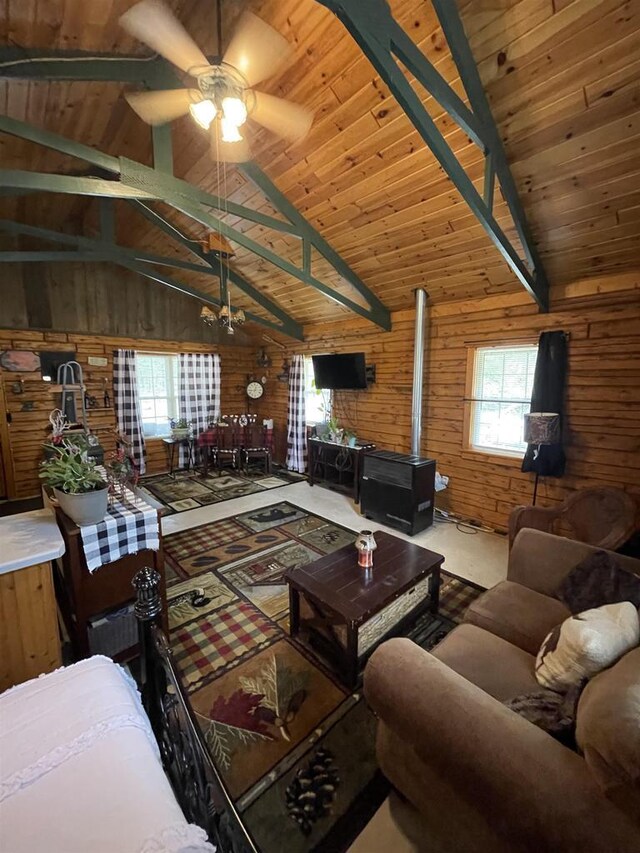 N18355 Big Bear Rd, Pembine, WI 54156 - living area featuring wood walls, ceiling fan, plenty of natural light, a wood stove, and wooden ceiling