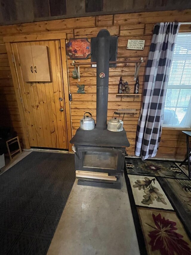 N18355 Big Bear Rd, Pembine, WI 54156 - detailed view of wooden walls, a wood stove, and concrete floors