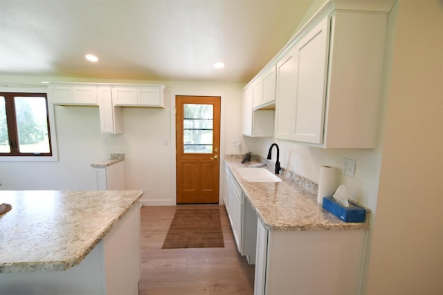 W13414 Liner Rd, Brandon, WI 53919 - kitchen with a sink, light wood-type flooring, healthy amount of natural light, white cabinetry, and recessed lighting