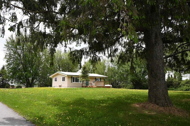 W13414 Liner Rd, Brandon, WI 53919 - ranch-style house with a front lawn and a wooden deck