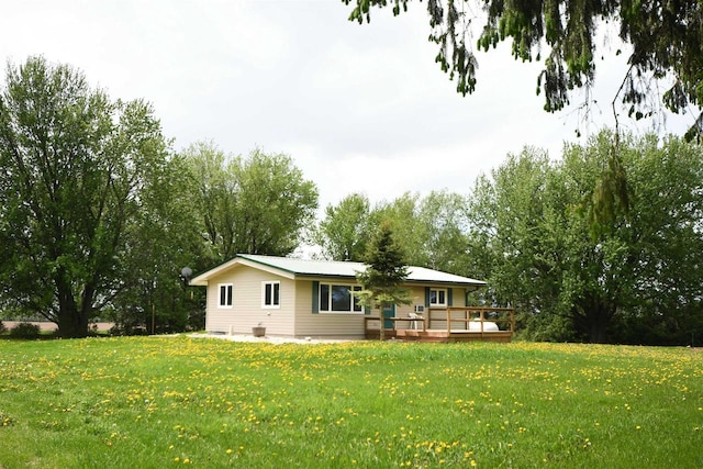 W13414 Liner Rd, Brandon, WI 53919 - back of house featuring a wooden deck and a lawn