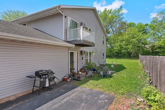 18 Northridge Ter, Madison, WI 53704 - view of side of property with a balcony, a shingled roof, and a patio