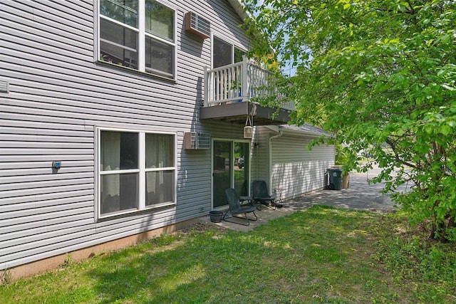 18 Northridge Ter, Madison, WI 53704 - rear view of house featuring a balcony, a patio, and a lawn