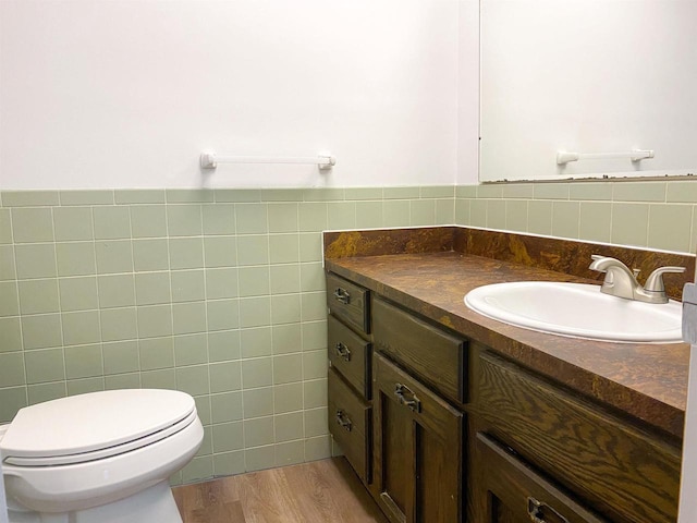 831 County Road Ig, Livingston, WI 53554 - bathroom with vanity, toilet, tile walls, and wood finished floors