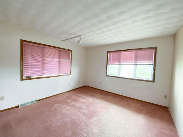 831 County Road Ig, Livingston, WI 53554 - carpeted empty room with baseboards and rail lighting