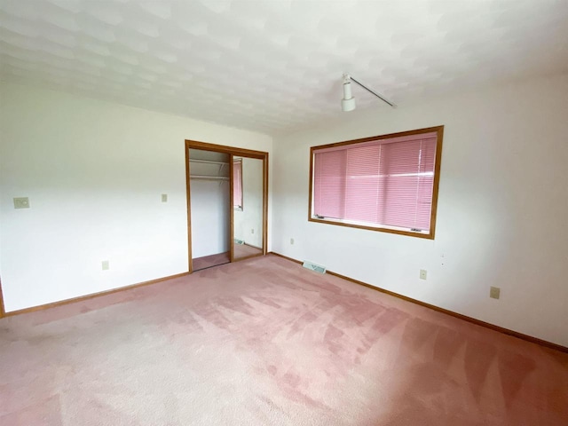 831 County Road Ig, Livingston, WI 53554 - unfurnished bedroom with carpet flooring, baseboards, and a closet